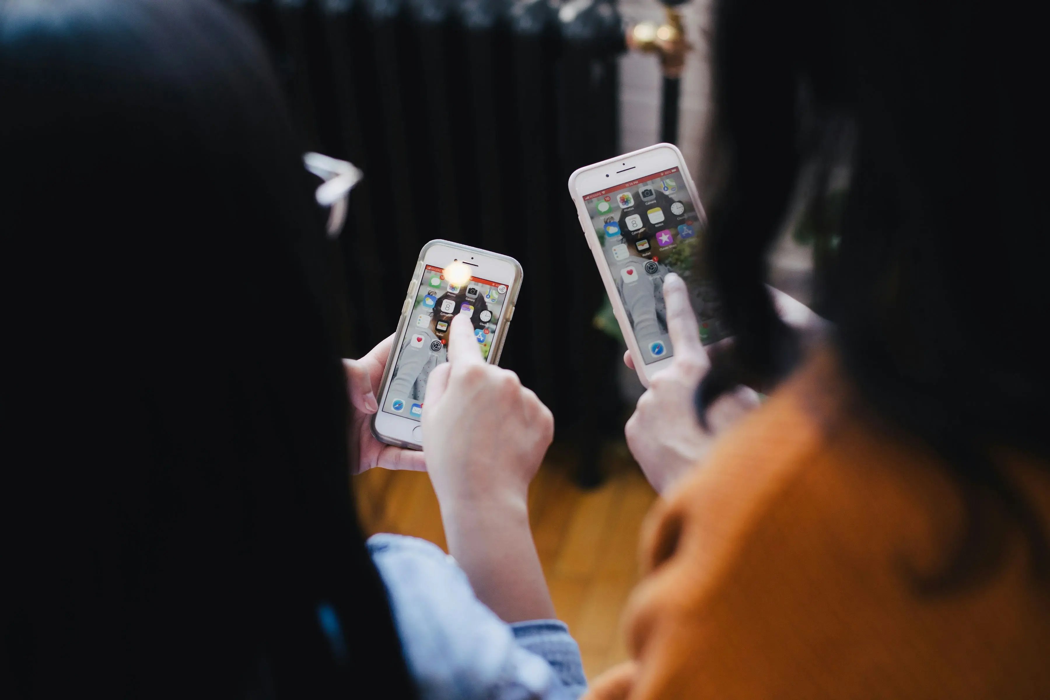 people selecting apps on a phone